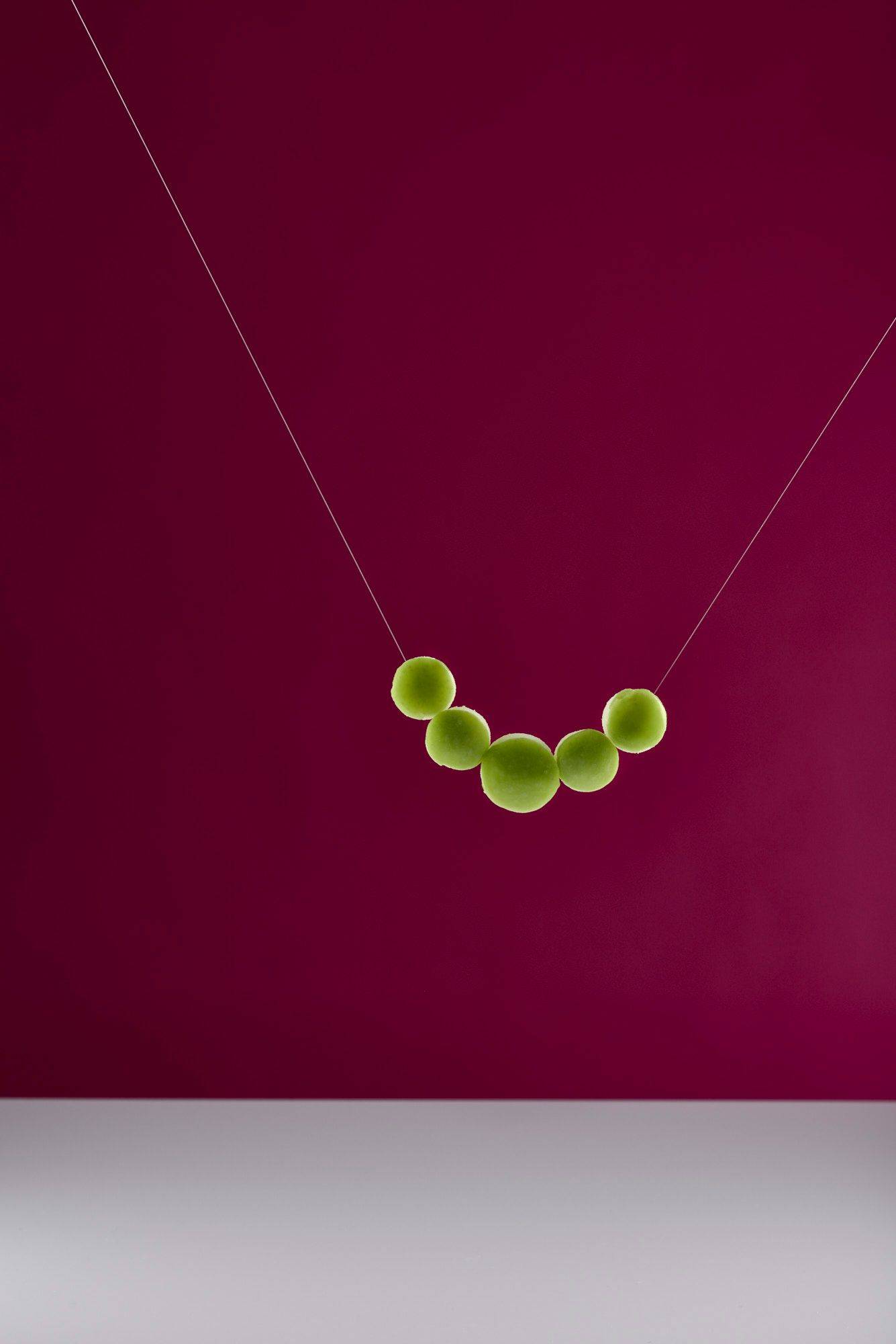 green-apple-pearl-necklace green apple pearl necklace with white and pink background