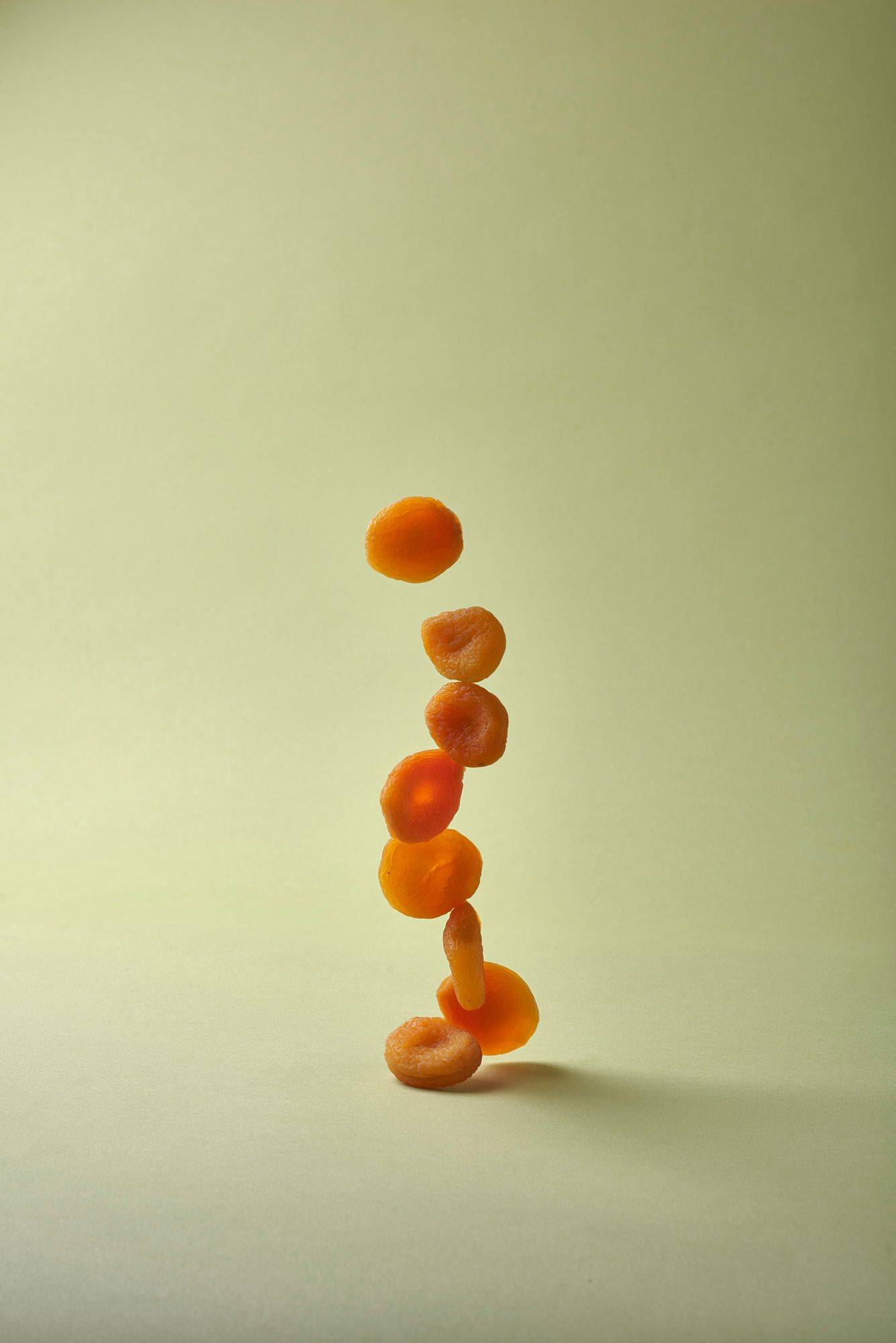 dried-apricots dried apricots with green background