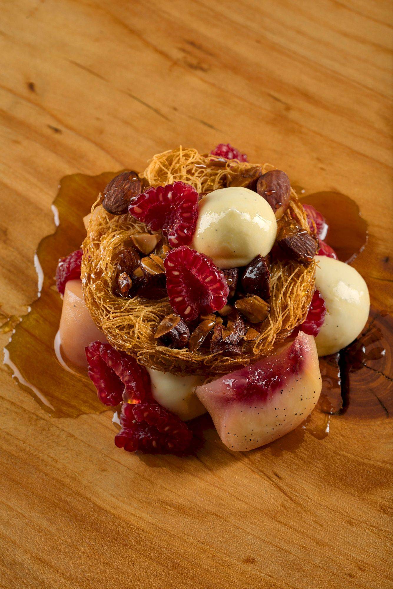 peach-melba-dessert peach melba dessert on a wooden plate