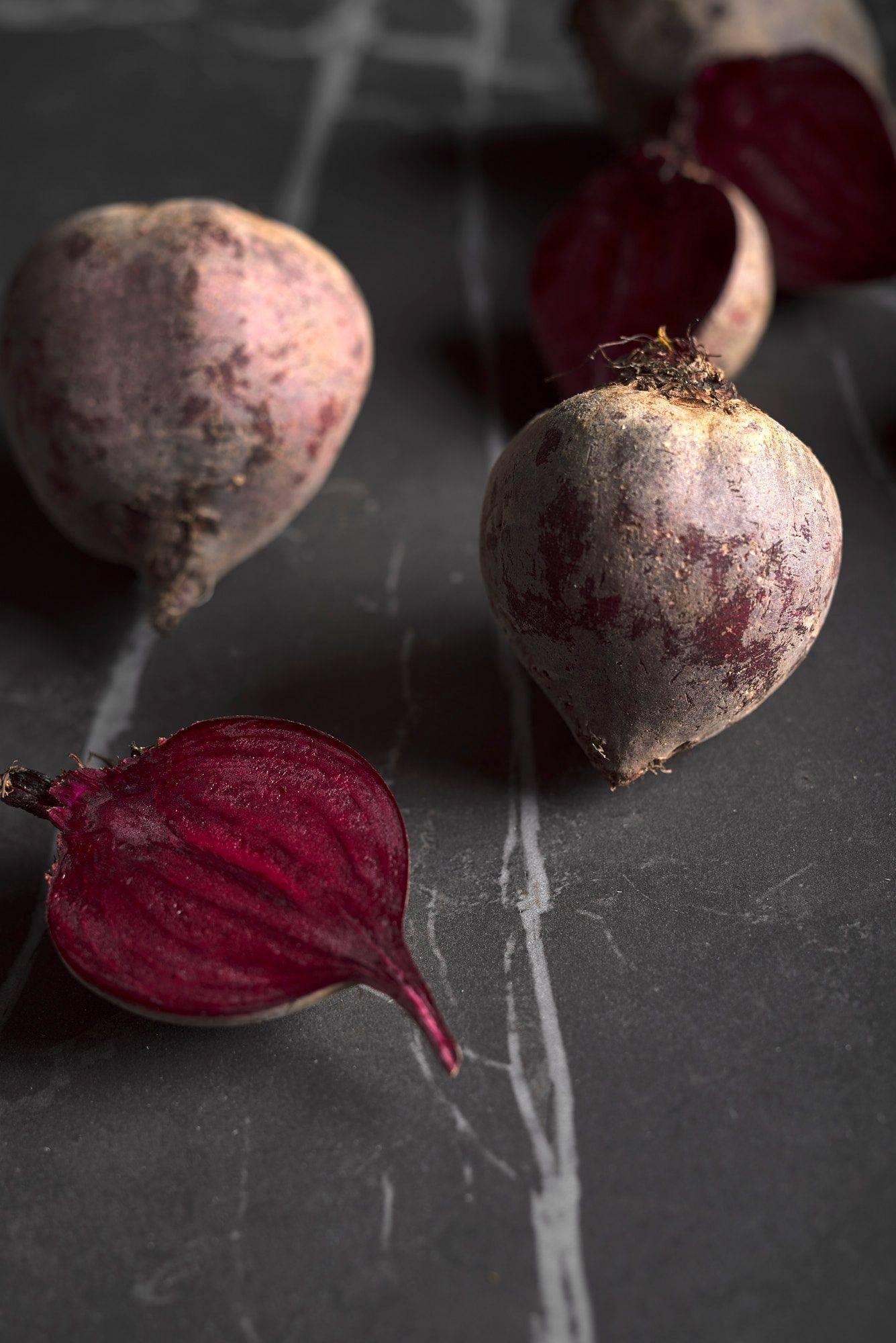 beetroot three pieces of beetroot on a gray sapienstone top
