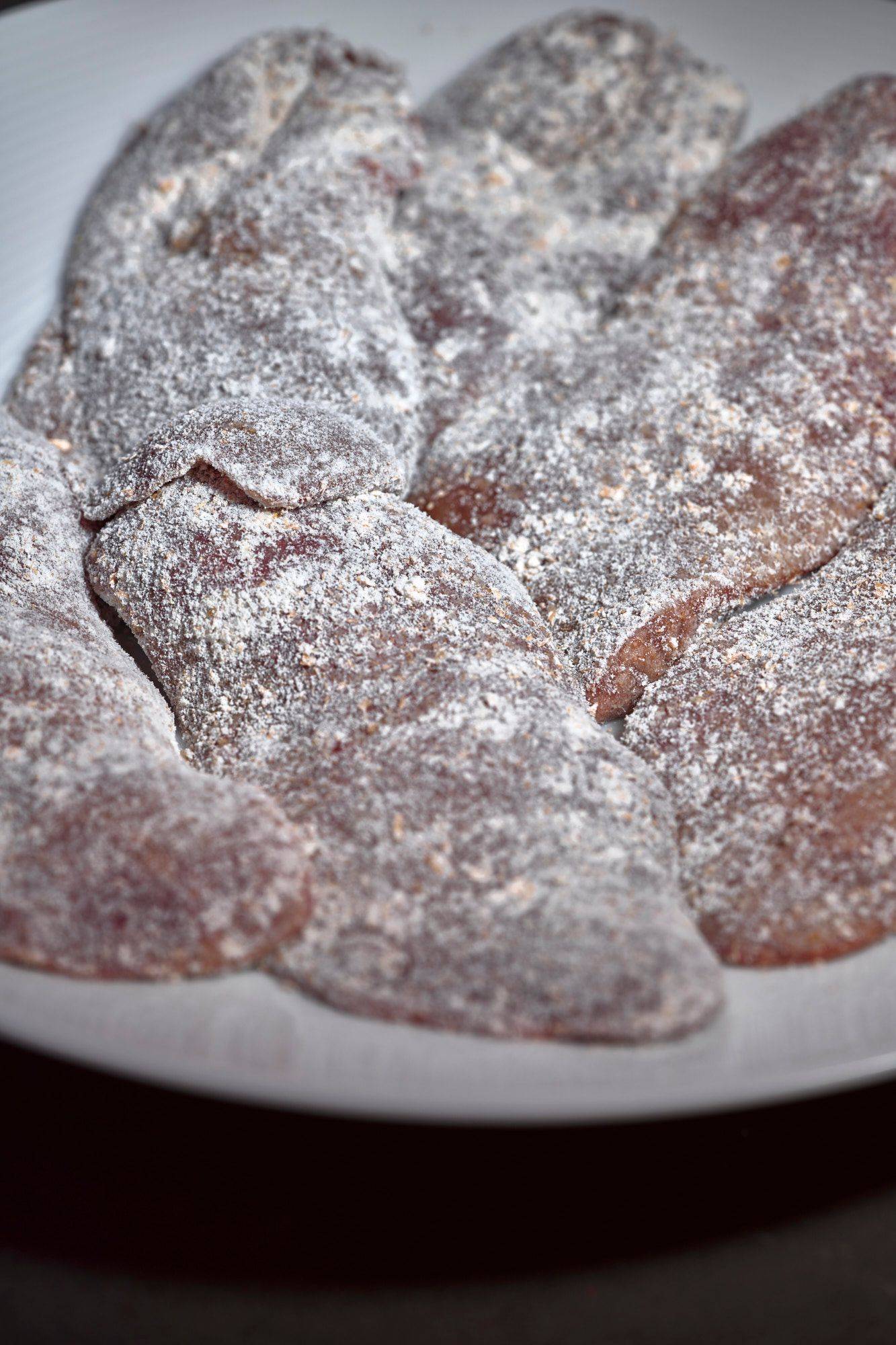 flour-tossed-raw-chicken-liver flour tossed raw chicken liver on a gray marbled sapienstone top