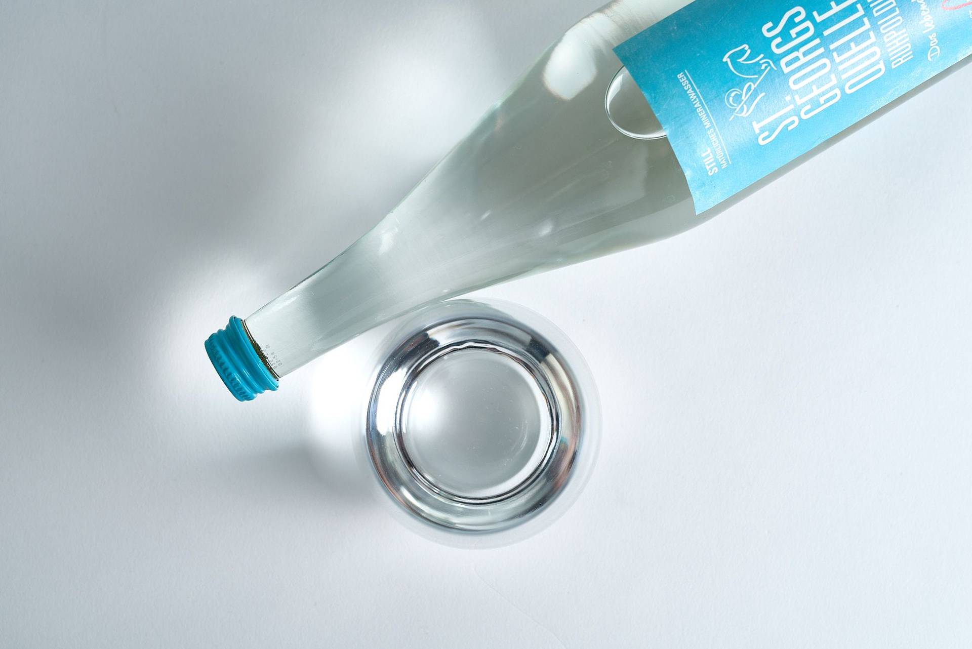 mineral-water mineral water bottle and glass on white background