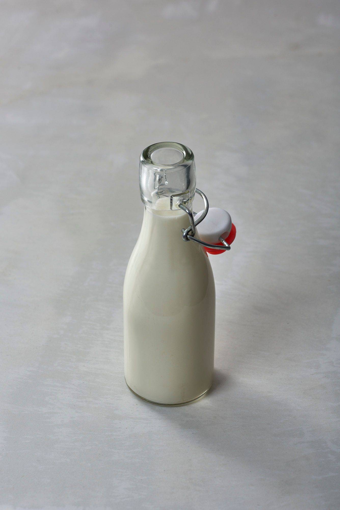 milk a small bottle of milk with white sapienstone top