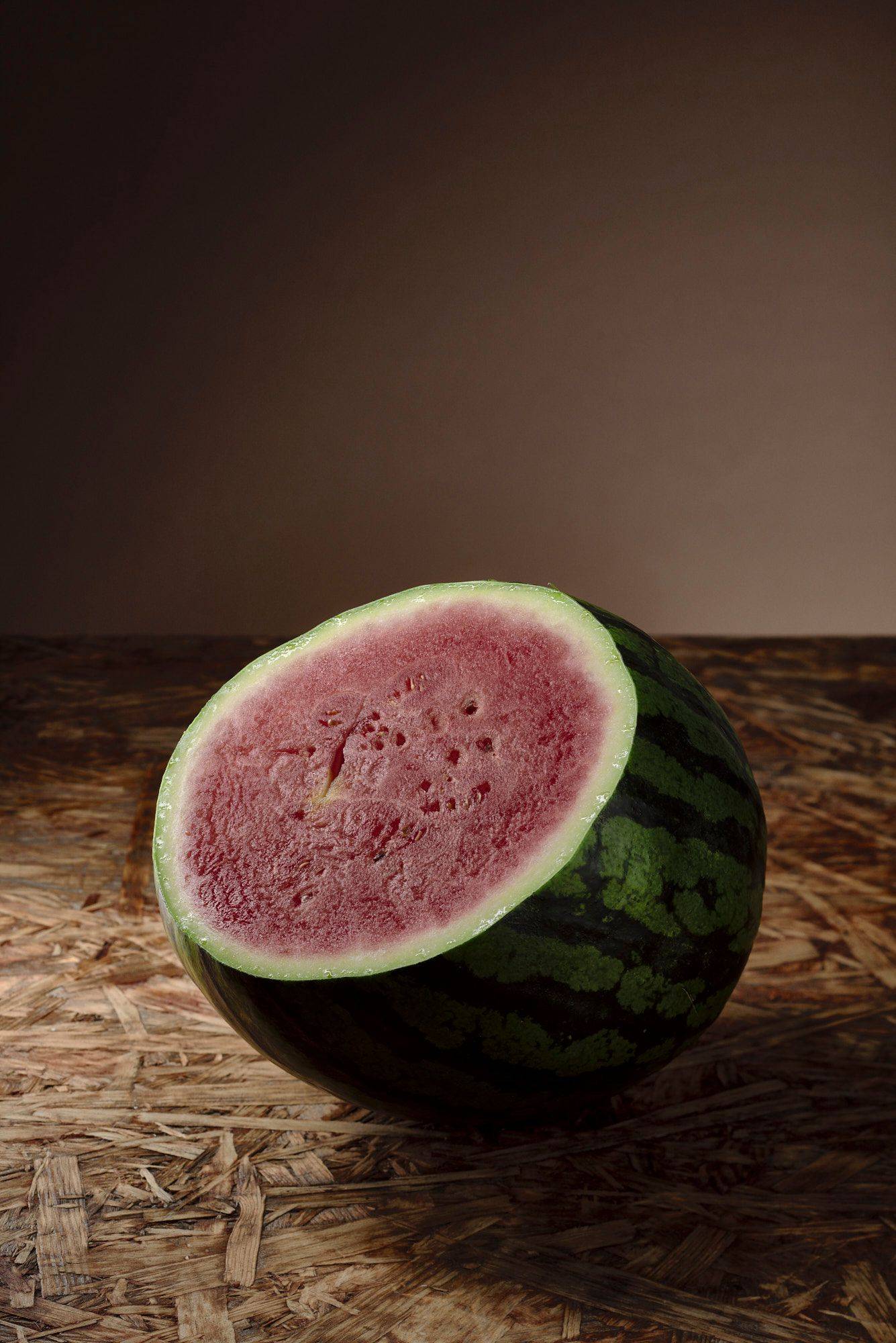 watermelon watermelon with brown wooden background