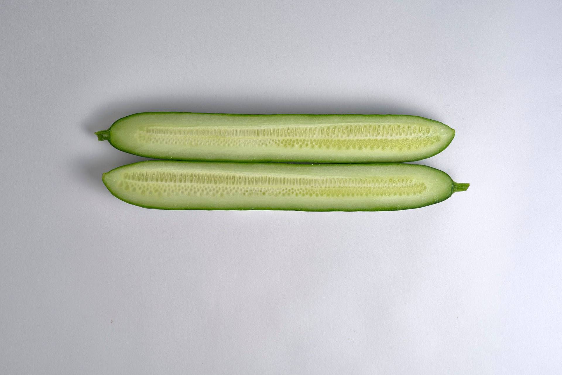cucumber a halved cucumber with white background