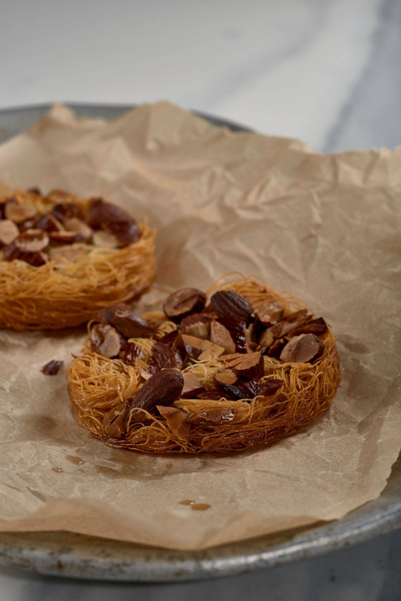 kataifi-and-almond-cracker kataifi and almond cracker on a baking sheet with a marbled sapienstone top