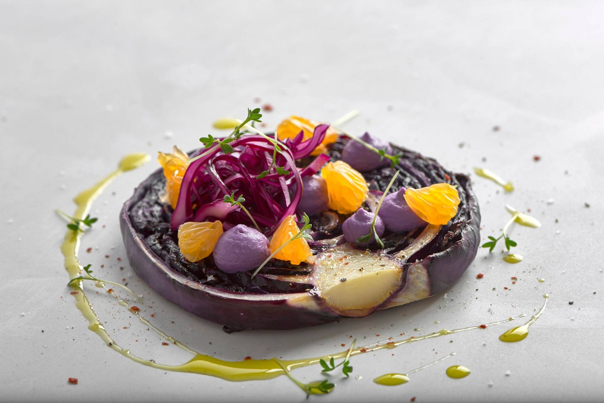 vegan-red-cabbage-steak-with-cashew-cream-and-tangerines vegan red cabbage steak with cashew cream and tangerines on a white sapienstone top