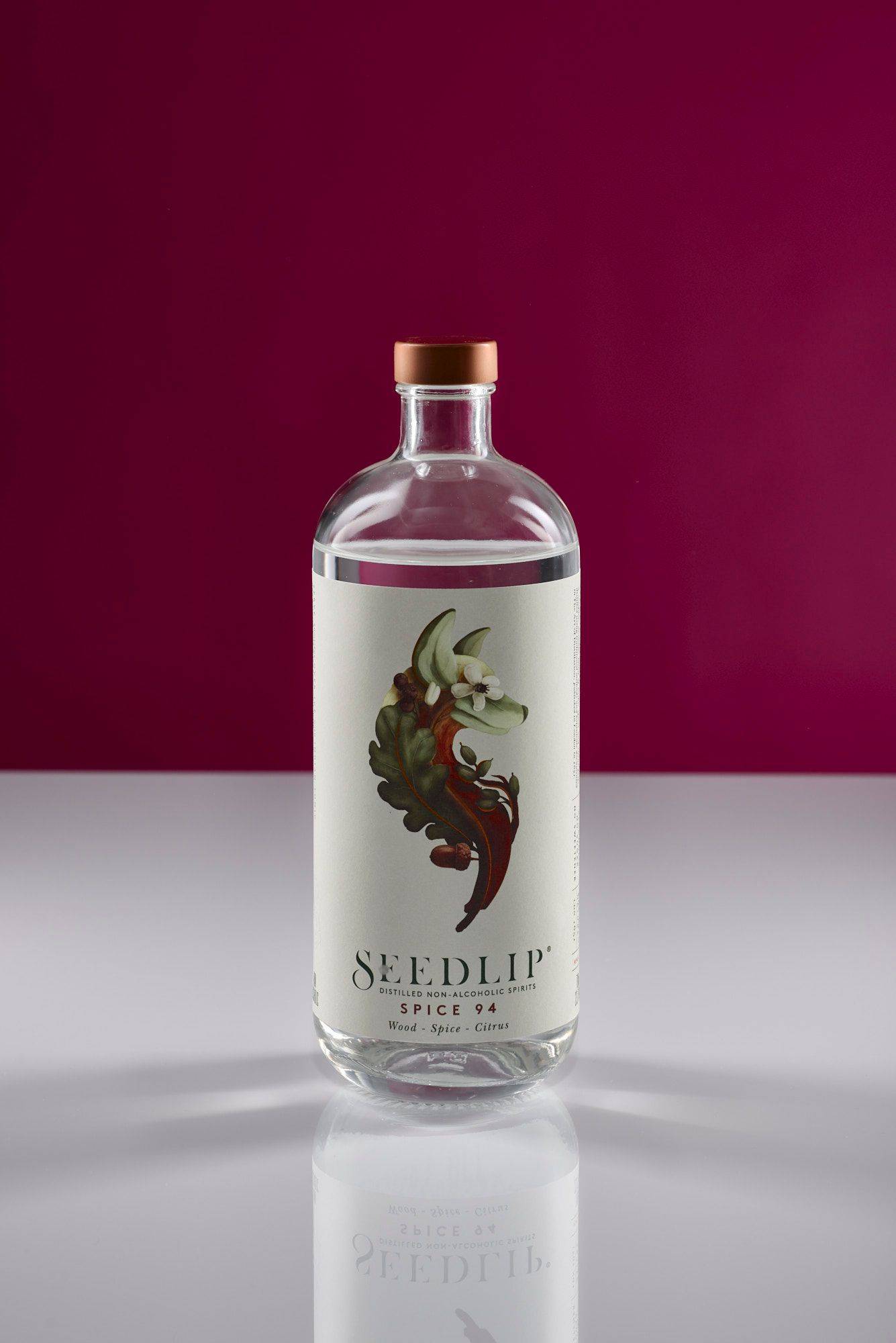 seedlip-spice-94 a bottle of non-alcoholic seedlip spice 94 with white and pink background