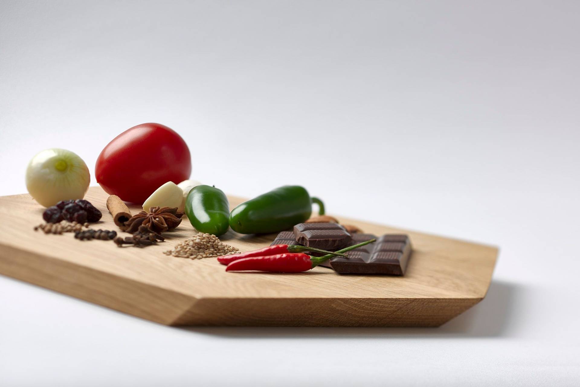 mole-sauce-ingredients mole sauce ingredients on a wooden board with white background