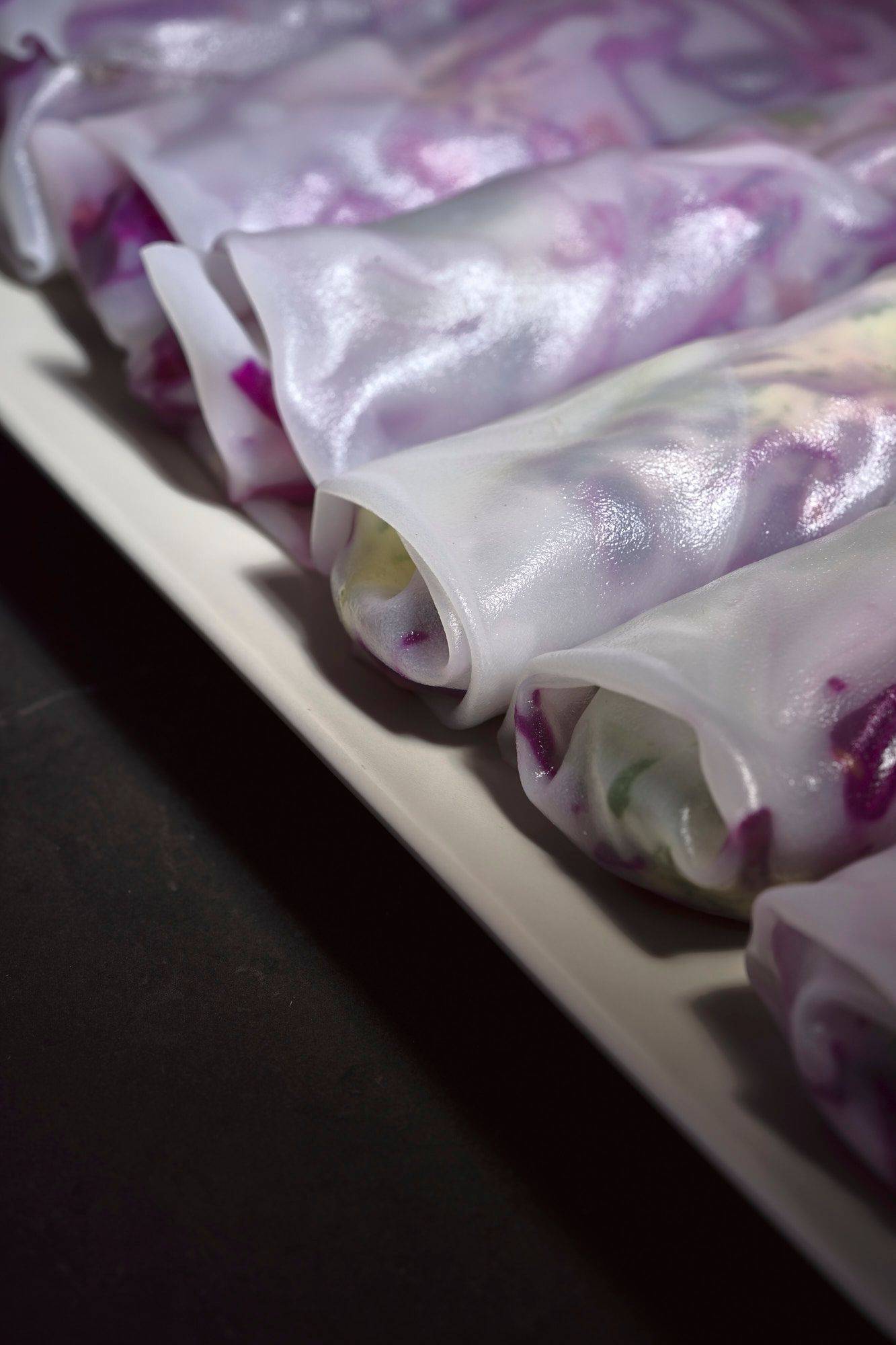 christmas-summer-rolls-with-red-cabbage-tangerine-salad-and-chicken-liver christmas summer rolls with red cabbage tangerine salad and chicken liver on a gray marbled sapienstone top