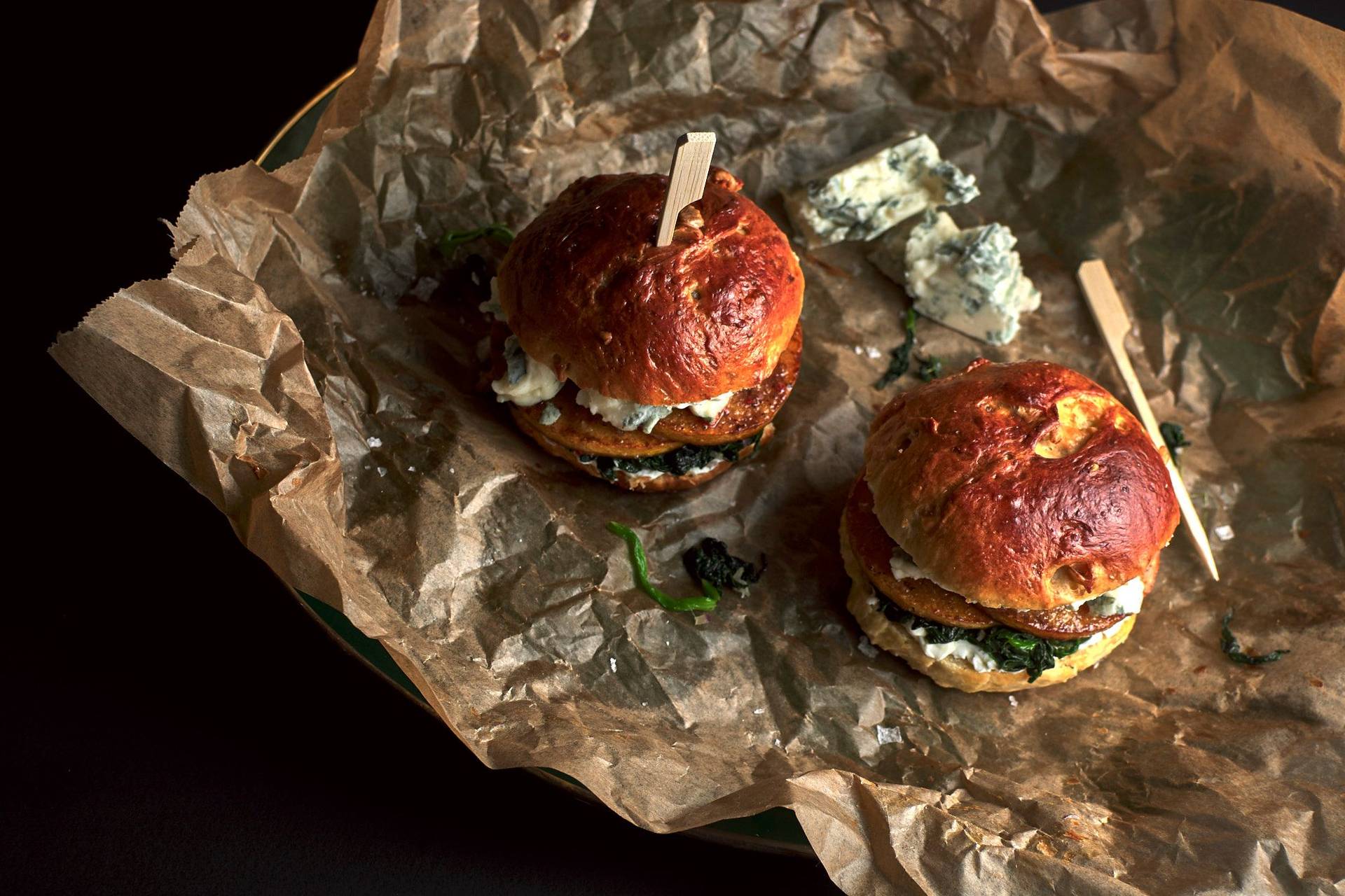 pumpkin-brioche-burger-with-blue-cheese pumpkin-brioche burger with blue cheese and spinach with black background