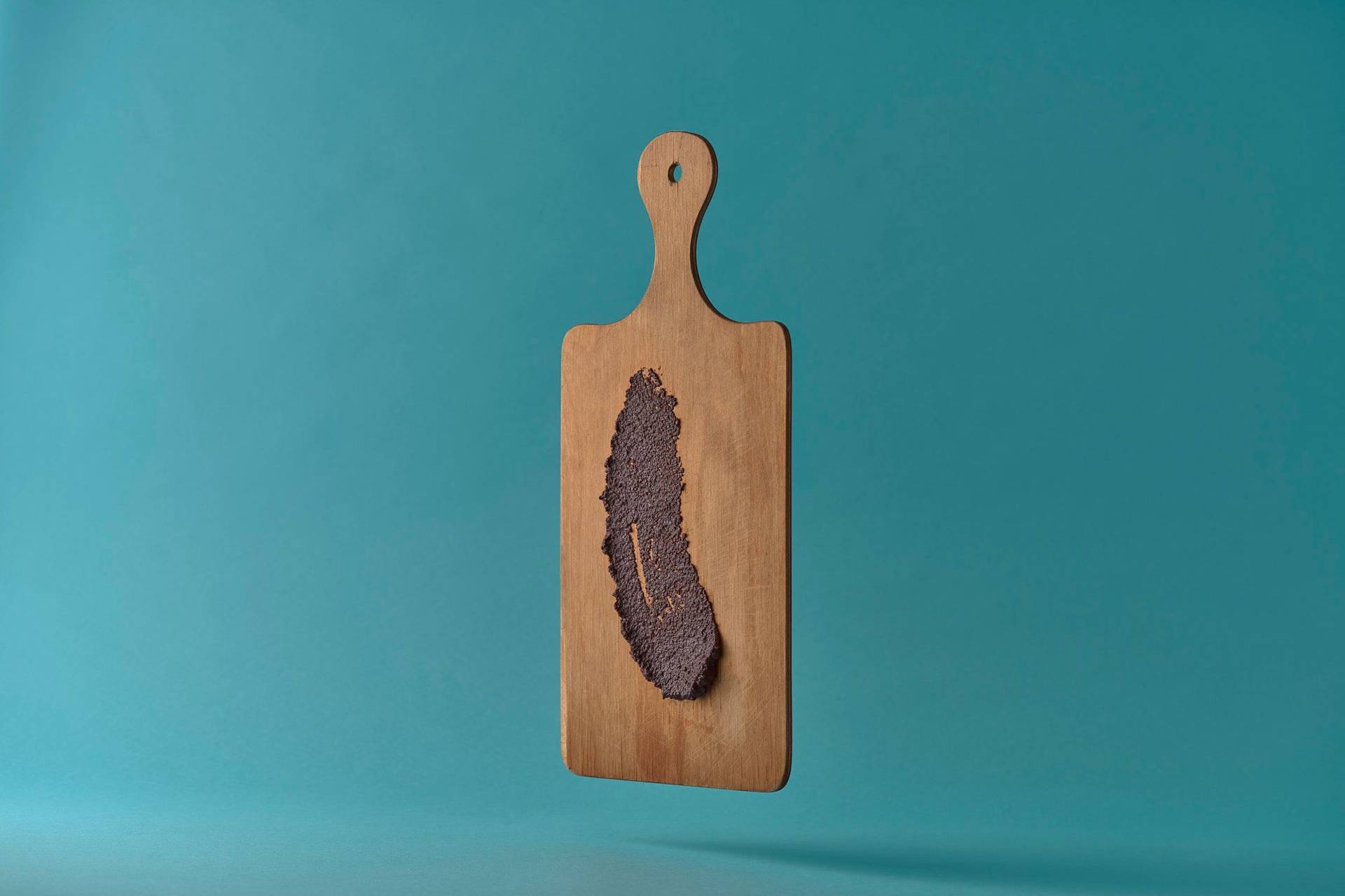 olive-tapenade-from-pouli olive tapenade from pouli on a wooden board on blue background
