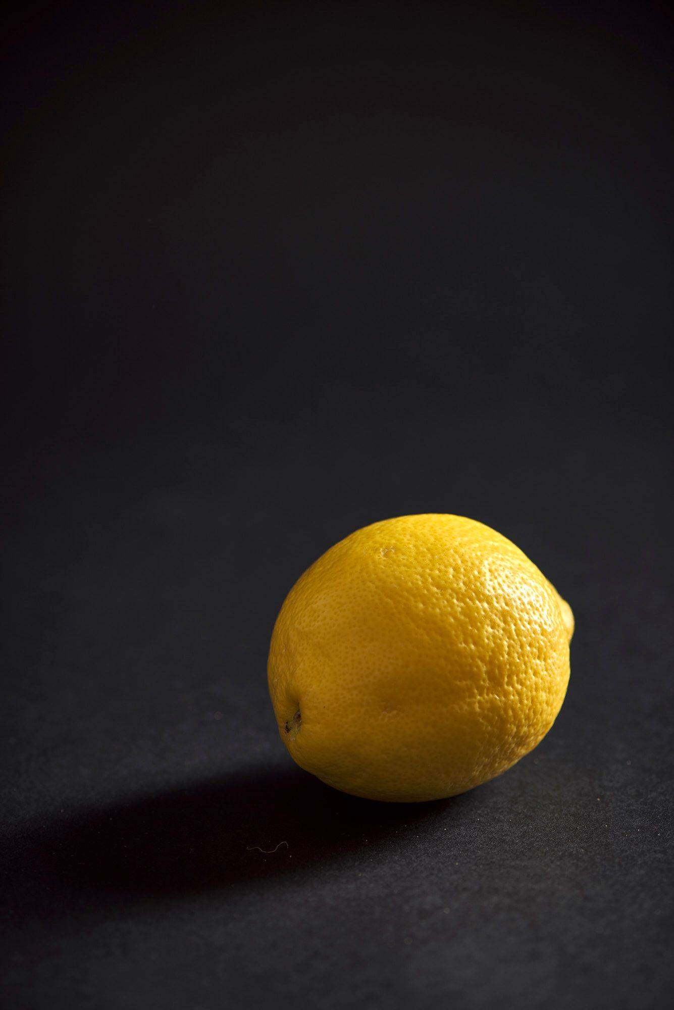 lemon a lemon on black background