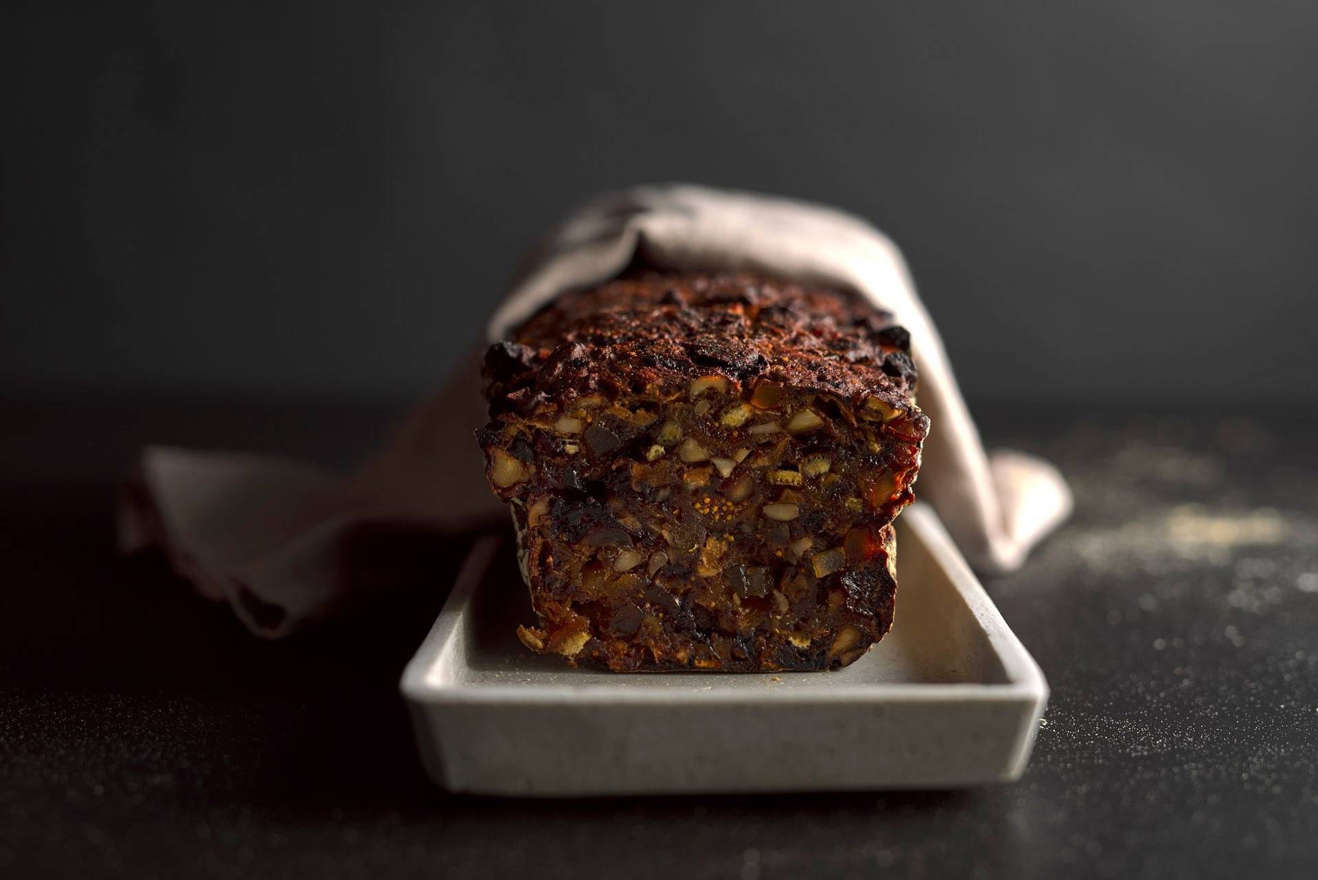 sugar-free-fruit-cake sugar-free fruit cake on a concrete plate with black background