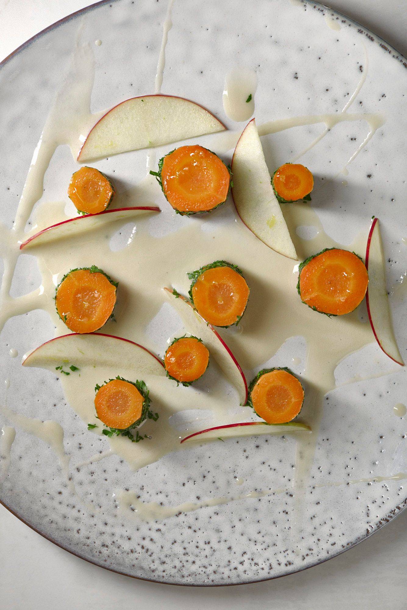carrot-and-hay carrot and hay on a white plate with white sapienstone top