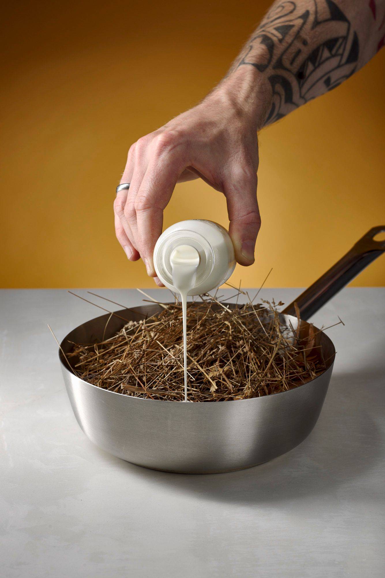 making-hay-sauce making hay sauce in a metal sauce pan with white sapienstone top and yellow background