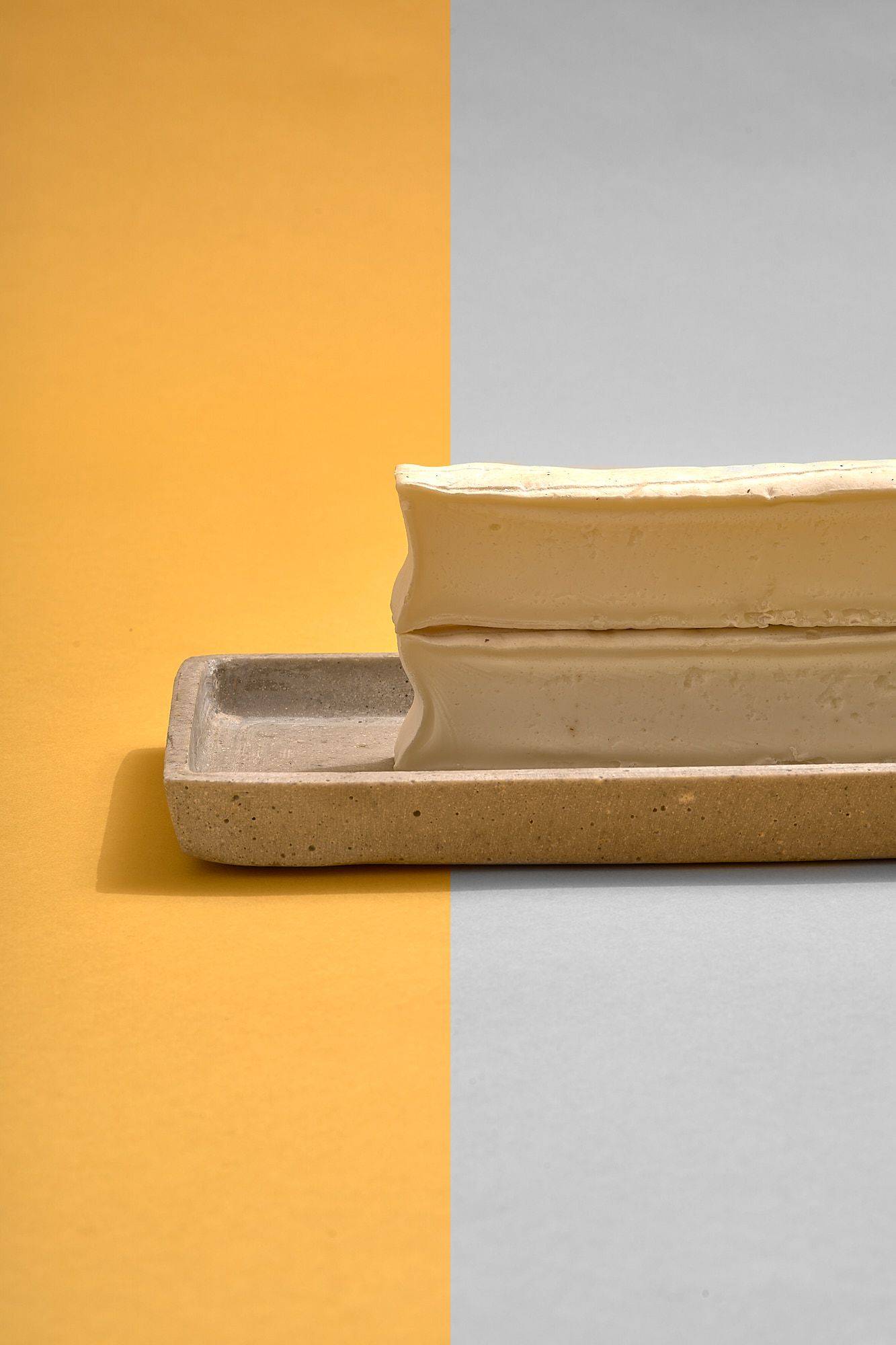 creamy-cheese-from-sheep creamy cheese from sheep on concrete plate on yellow background