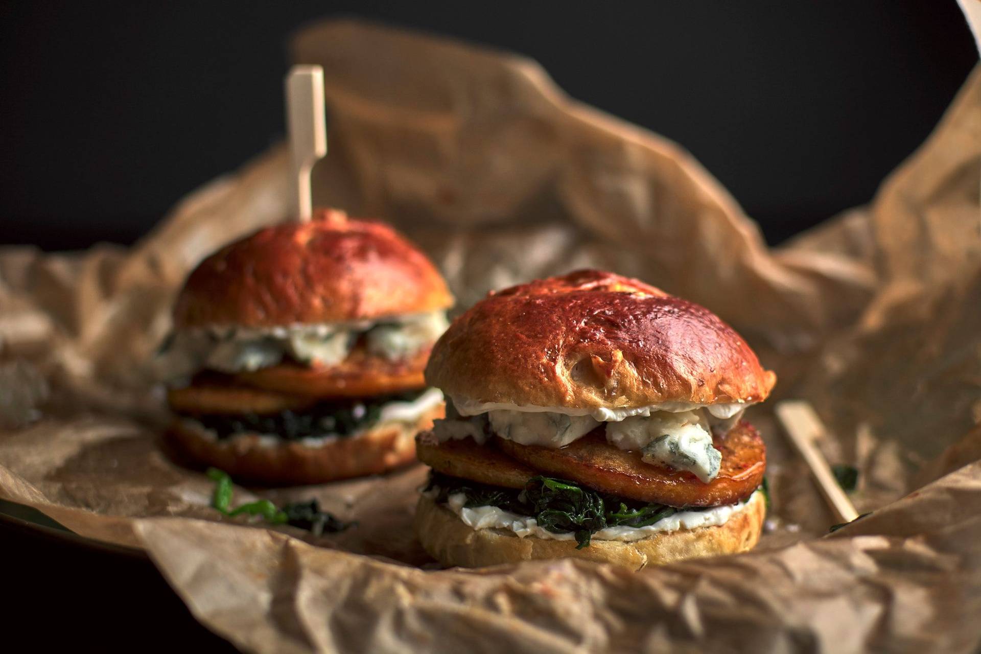 pumpkin-brioche-burger-with-blue-cheese pumpkin-brioche burger with blue cheese and spinach with black background