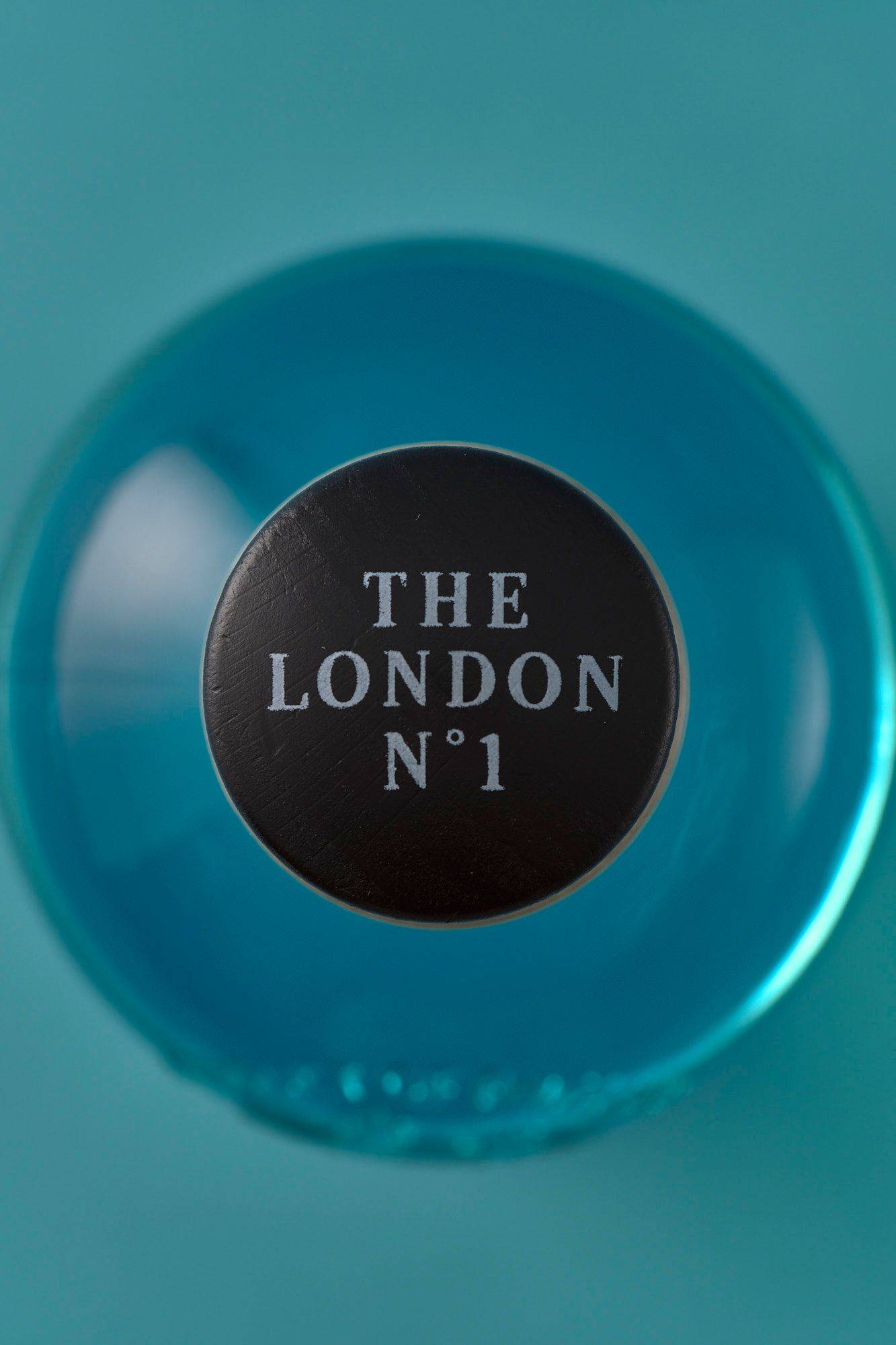 the-london-number-one-gin a bottle of the london number one gin on blue background