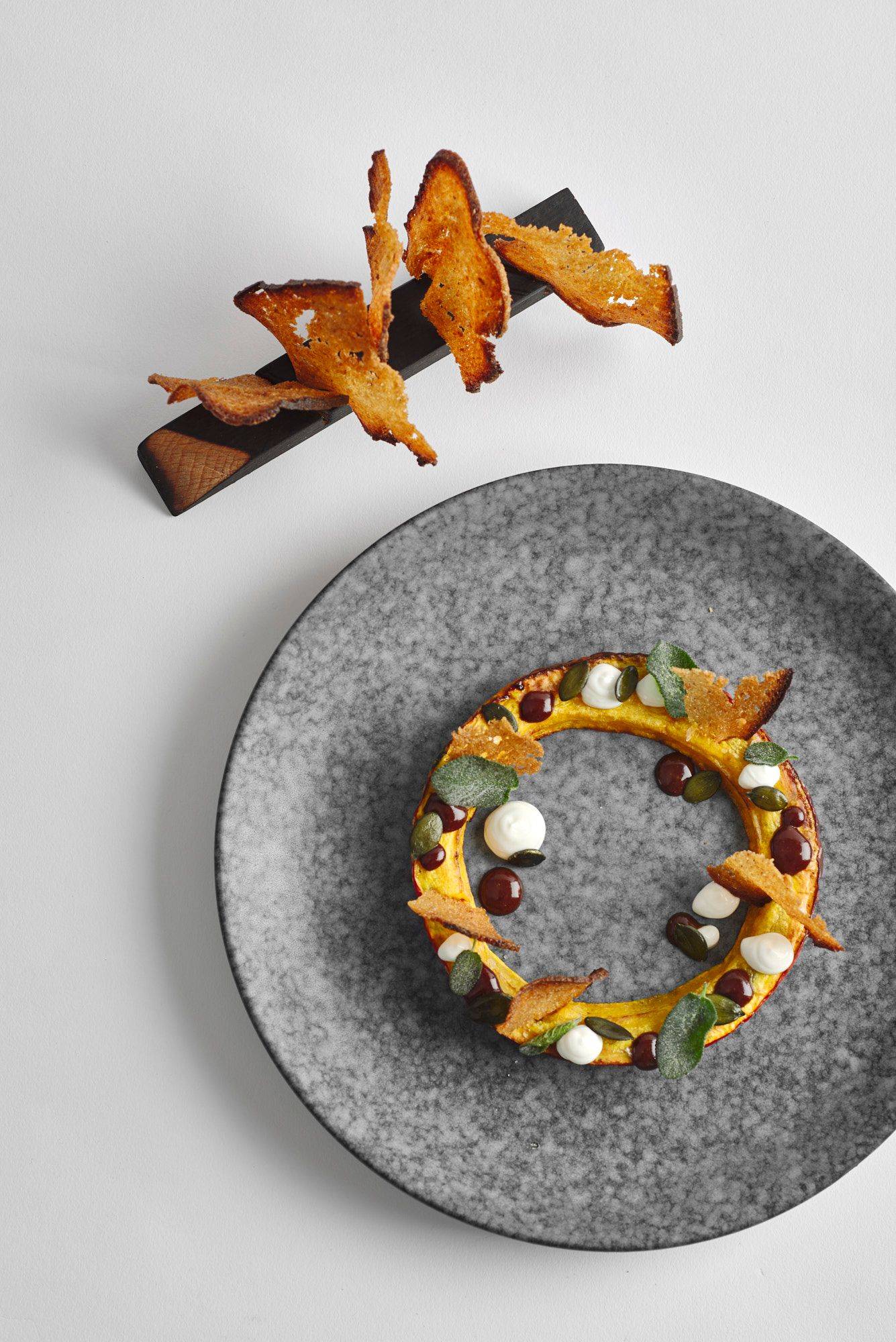 pumpkin-variation-with-sage-and-sourdough-bread pumpkin variation with sage and sourdough bread on a gray plate with white background