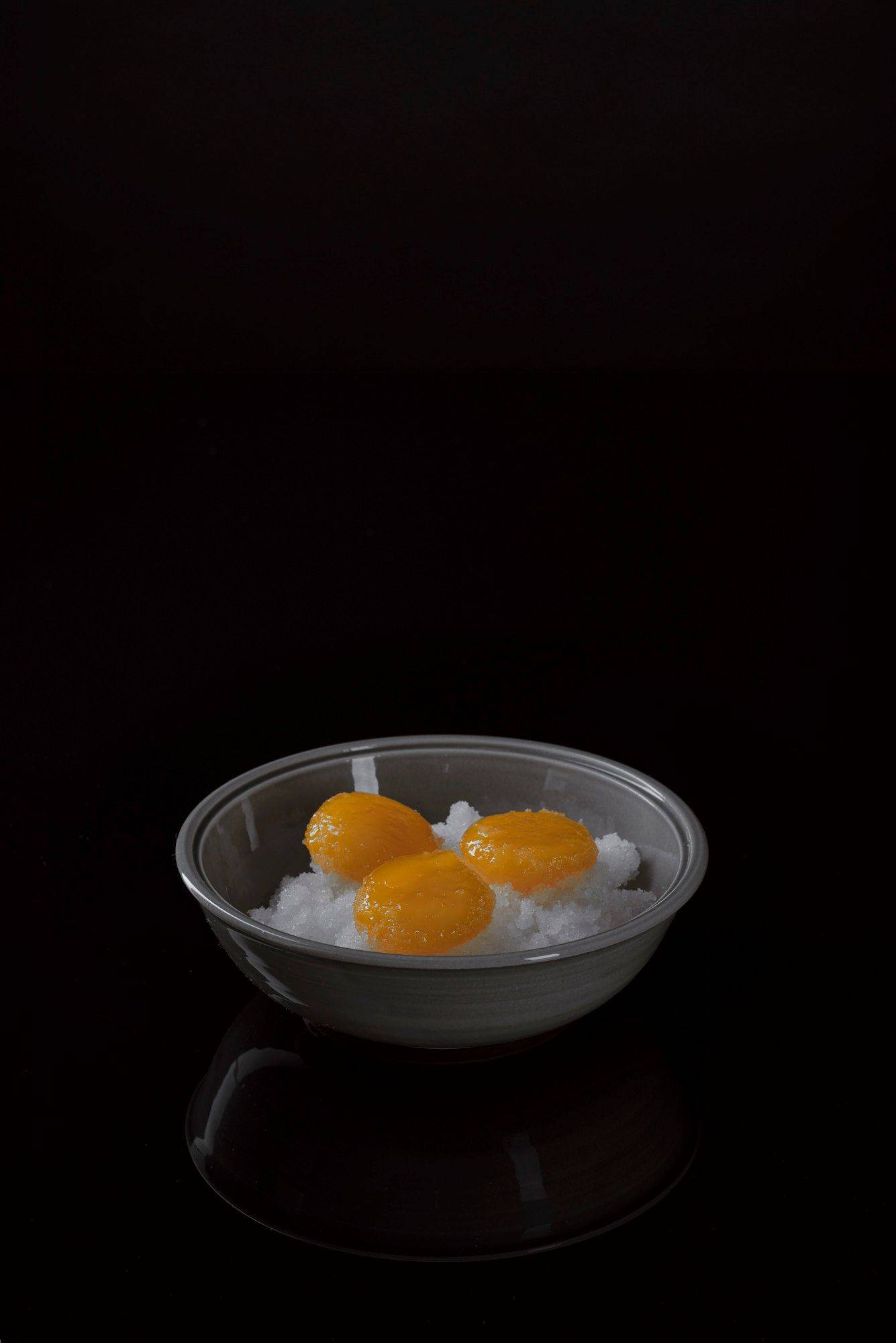 cured-egg-yolks cured egg yolks with black background