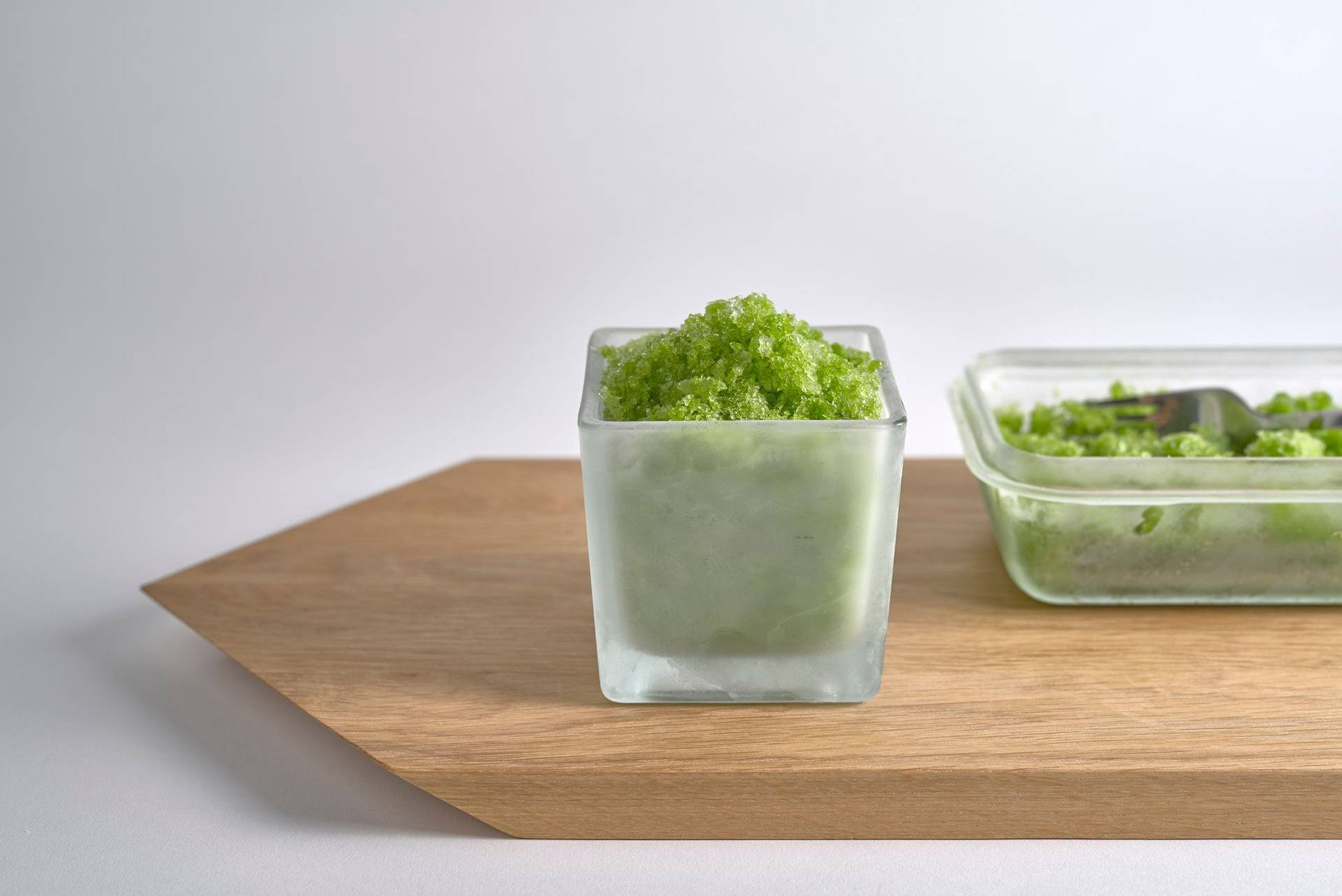 dill-granita frozen dill granita on a wooden board with white background