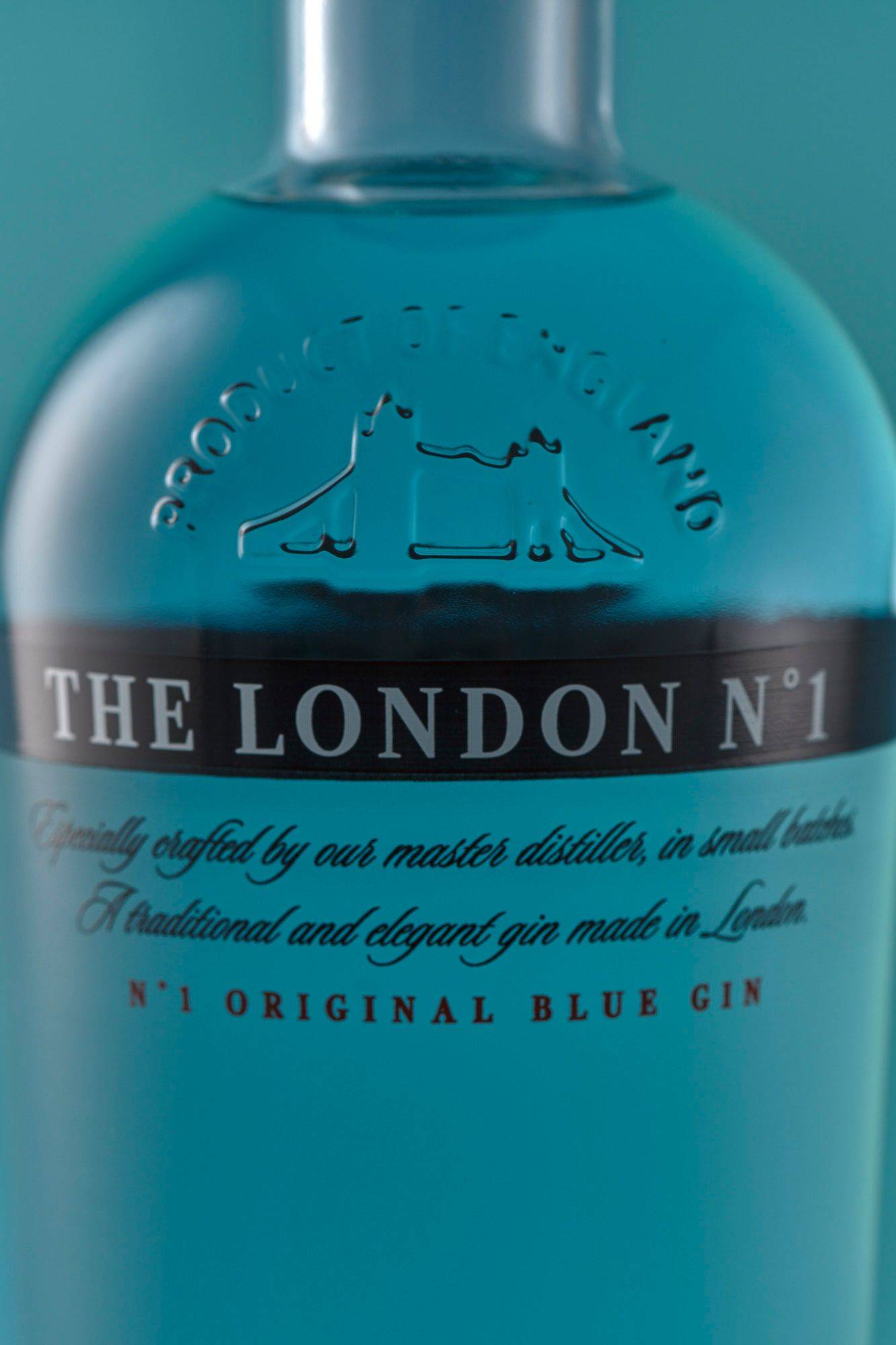 the-london-number-one-gin a bottle of the london number one gin on blue background