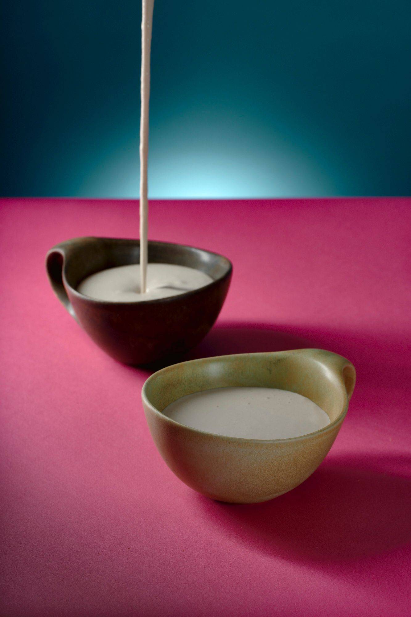 sunflower-seed-cream sunflower seed cream in ceramic cups with pink and blue background