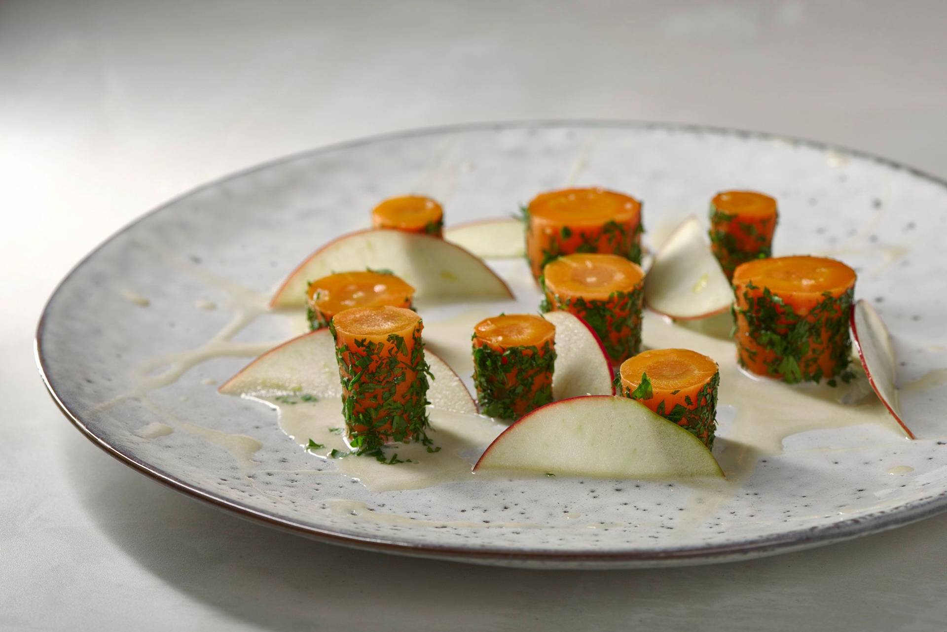 carrot-and-hay carrot and hay on a white plate with white sapienstone top