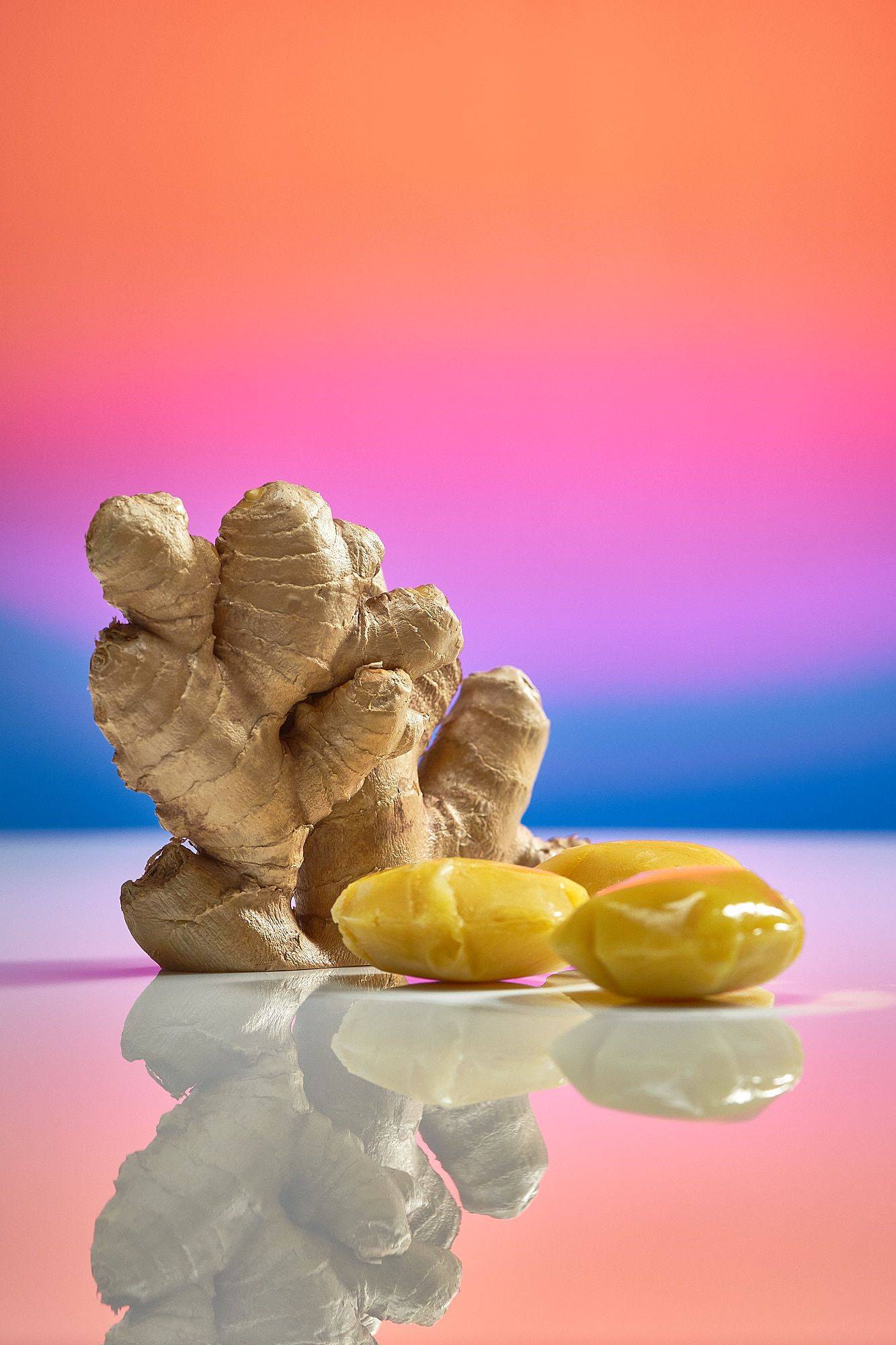 fresh-ginger-and-ginger-ice-cubes fresh ginger and ginger ice cubes on rainbow colored background