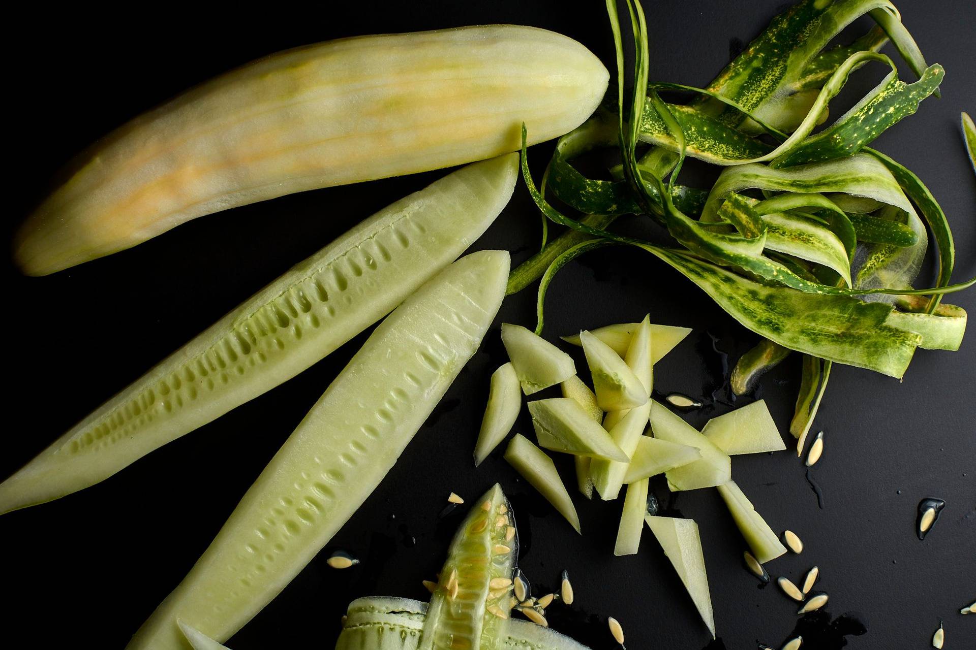 chopped-cucumber chopped cucumber on black background