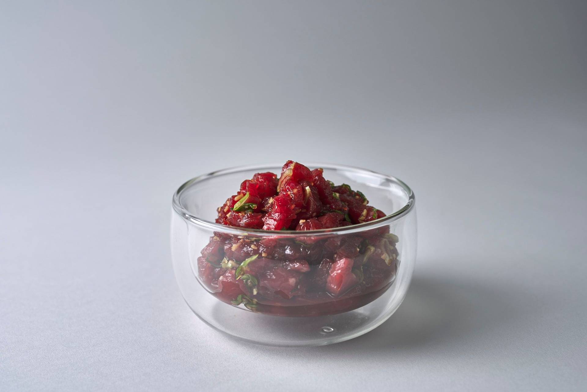 bulgogi-beef marinated bulgogi beef in a glass bowl with white background