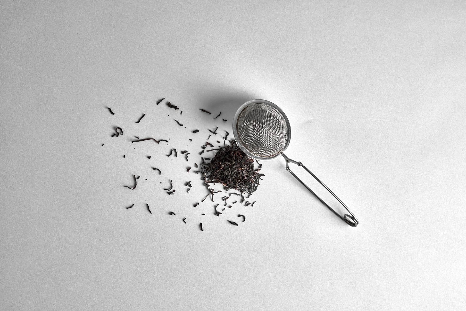 tea tea and a sieve on white background